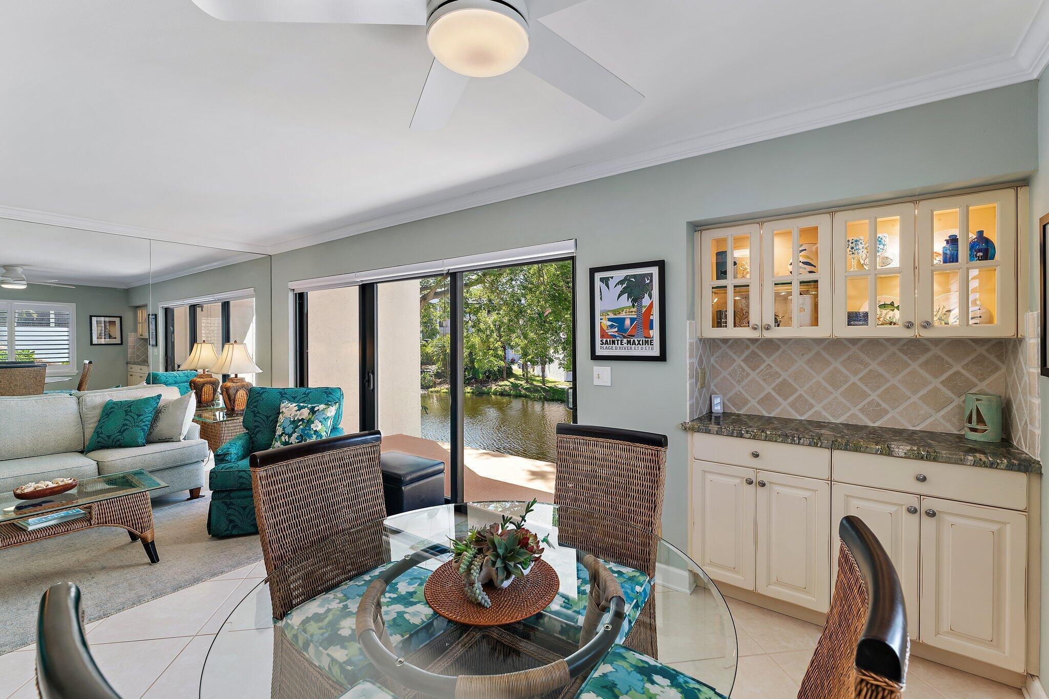 1605 Us-1, Unit B206 Jupiter, FL 33477 - Photo 10 of 35 a living room with furniture and a large window