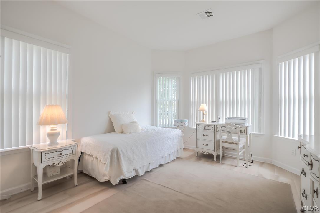 5536 Republic Way Bethlehem, PA 18017 - Photo 14 of 34 a bedroom with a bed and large windows