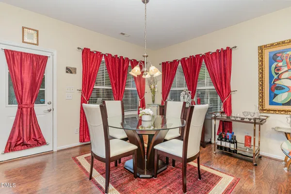 a view of a dining room with furniture and window