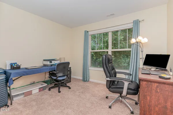 a view of a workspace with furniture