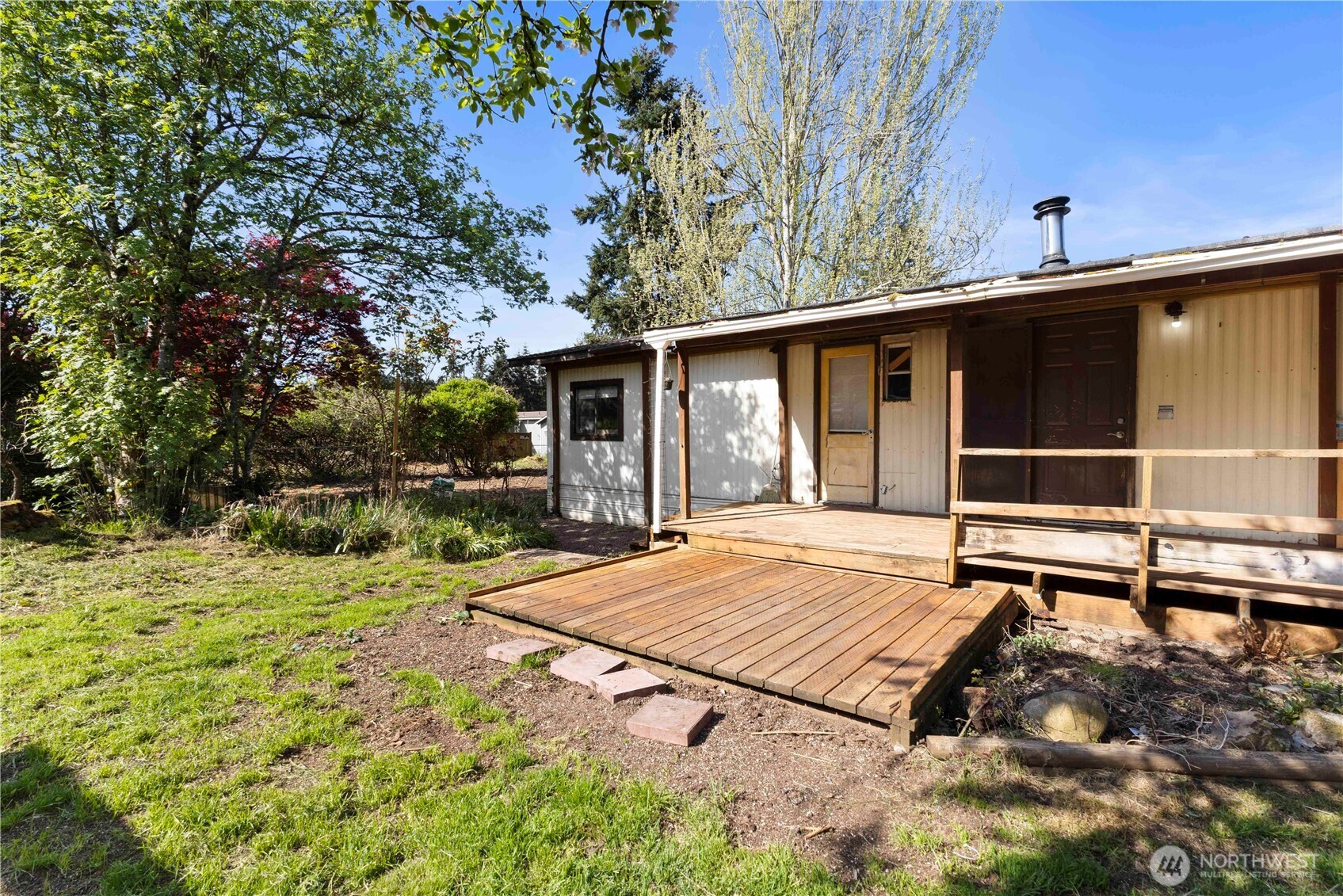 13125 Ridge Circle East Bonney Lake, WA 98391 - Photo 15 of 15 a view of backyard with wooden floor and fence