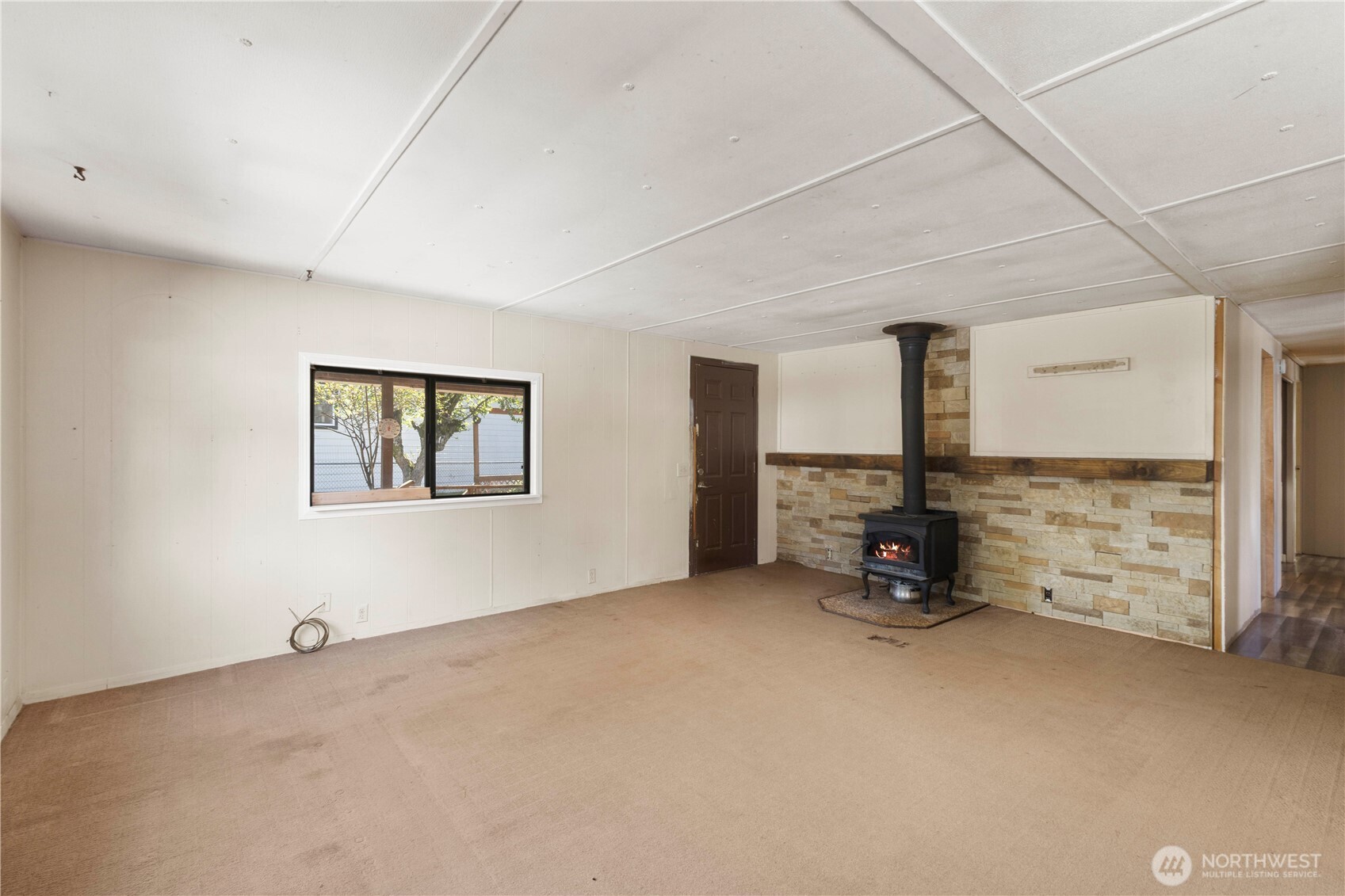 13125 Ridge Circle East Bonney Lake, WA 98391 - Photo 6 of 15 a view of an empty room with a window