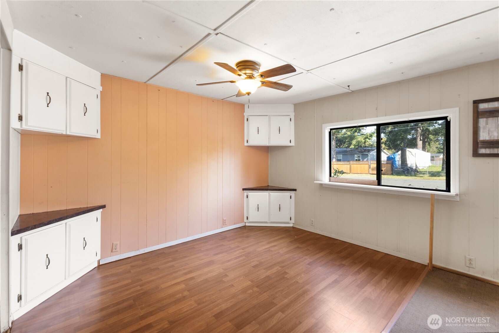 13125 Ridge Circle East Bonney Lake, WA 98391 - Photo 7 of 15 wooden floor in an empty room with a window