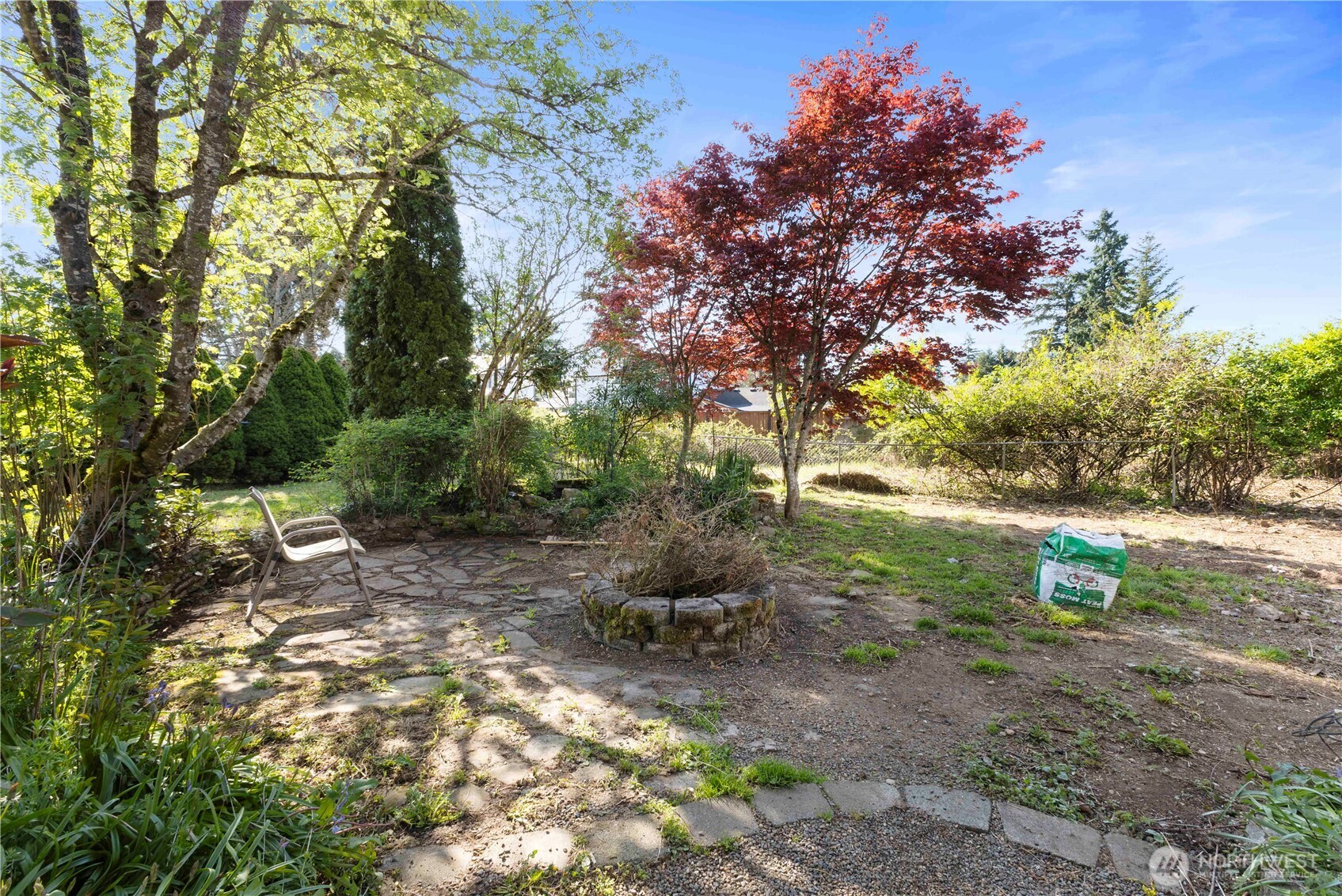 13125 Ridge Circle East Bonney Lake, WA 98391 - Photo 9 of 15 a backyard of a house with lots of green space