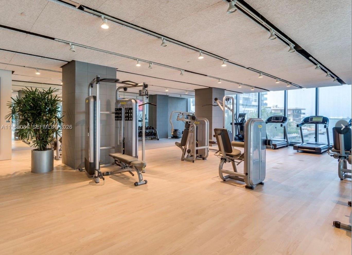 460 Northeast 28th Street, Unit 2102 Miami, FL 33137 - Photo 12 of 14 a view of a room with gym equipment