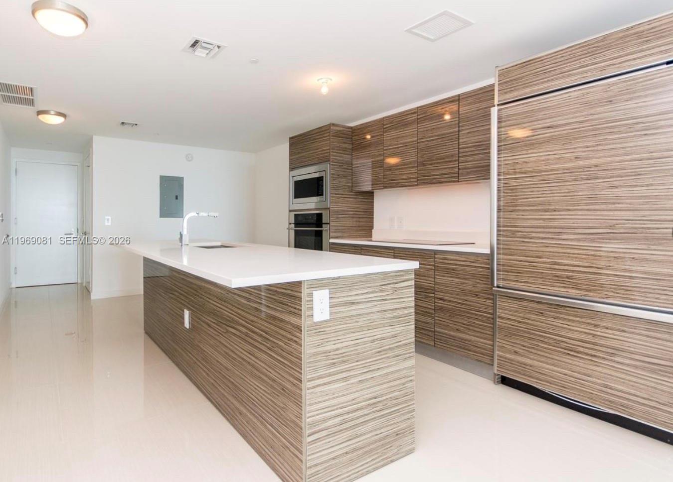460 Northeast 28th Street, Unit 2102 Miami, FL 33137 - Photo 13 of 14 a bathroom with a sink a mirror and shower