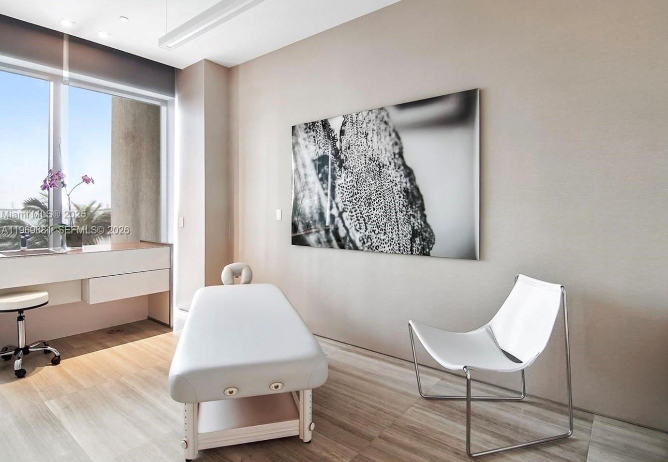 460 Northeast 28th Street, Unit 2102 Miami, FL 33137 - Photo 5 of 14 a living room with furniture and a painting on the wall