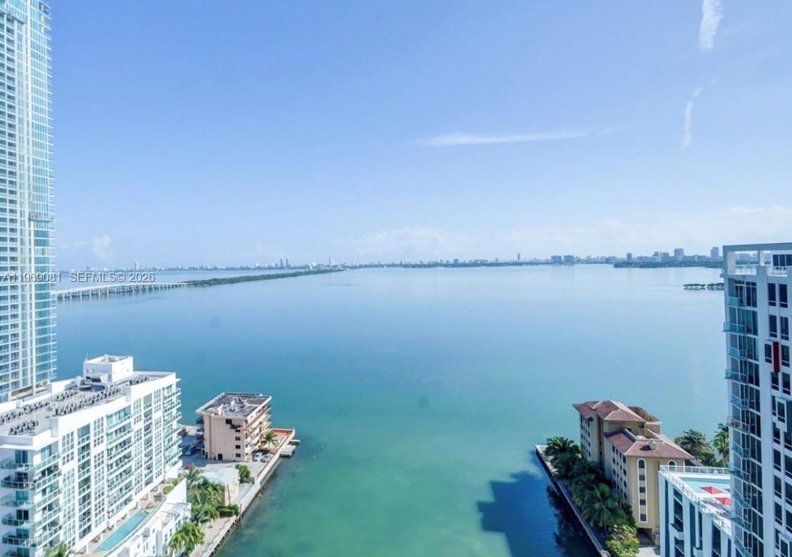 460 Northeast 28th Street, Unit 2102 Miami, FL 33137 - Photo 8 of 14 a view of a lake with a table