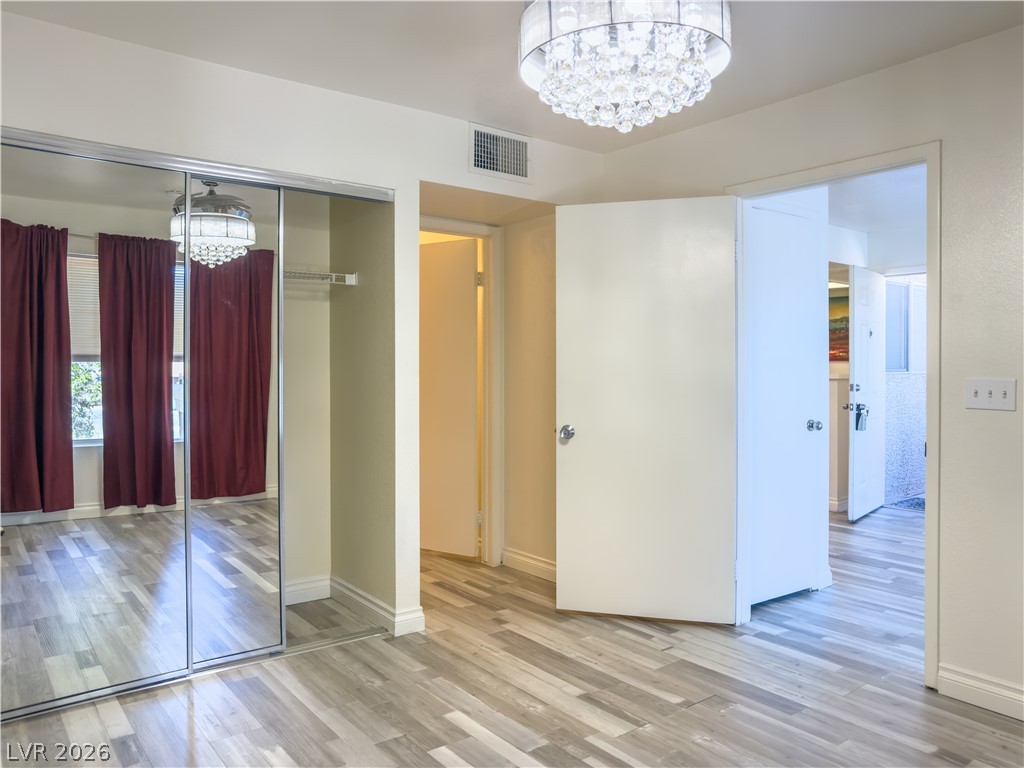8070 West Russell Road, Unit 2063 Las Vegas, NV 89113 - Photo 9 of 9 Mirrored closet doors offer both utility and visual spaciousness in this comfortable bedroom.