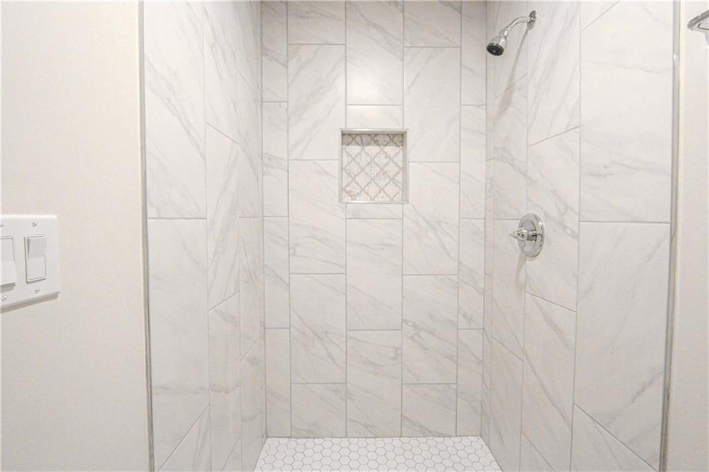 102 Welch Street Stockbridge, GA 30281 - Photo 13 of 28 a bathroom with a shower