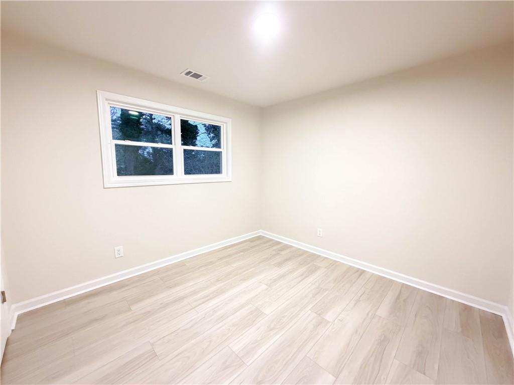 102 Welch Street Stockbridge, GA 30281 - Photo 14 of 28 a view of an empty room with a window