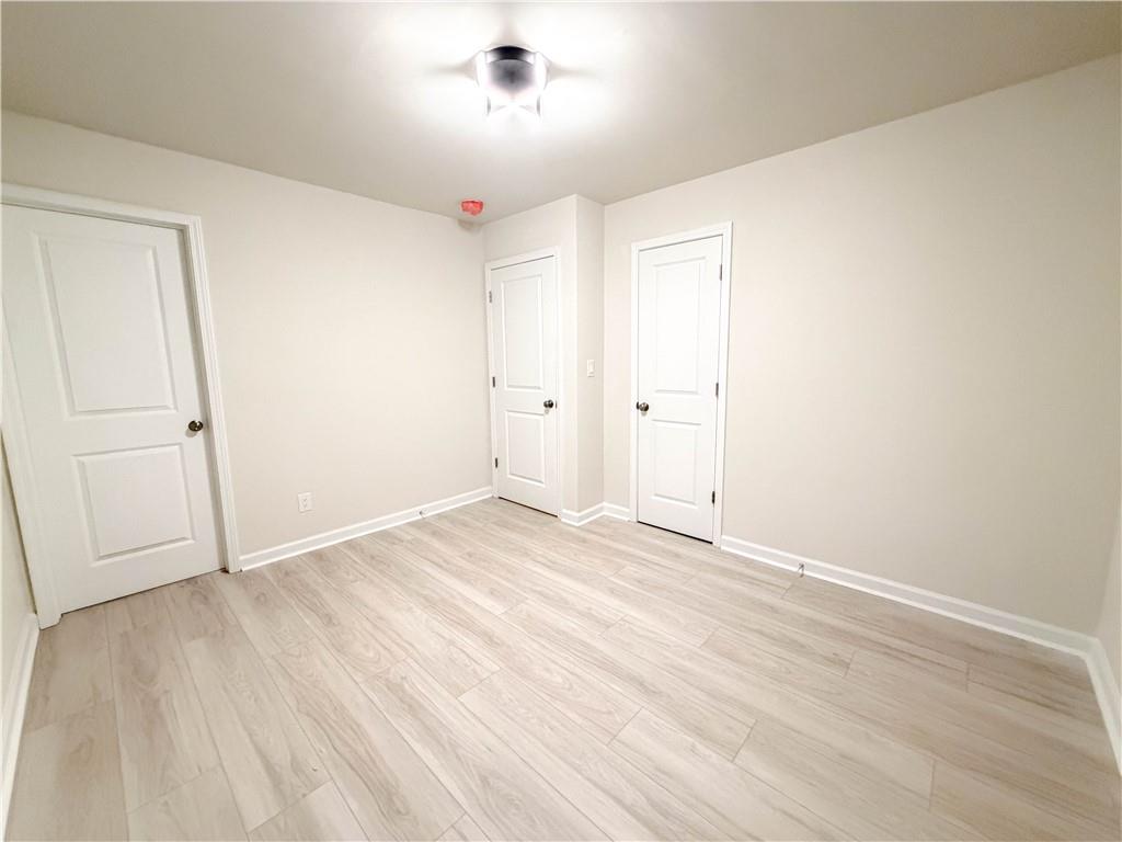 102 Welch Street Stockbridge, GA 30281 - Photo 19 of 28 wooden floor in an empty room