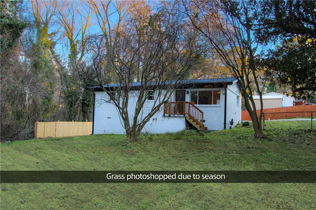 102 Welch Street Stockbridge, GA 30281 - Photo 23 of 28 a view of a house with a yard