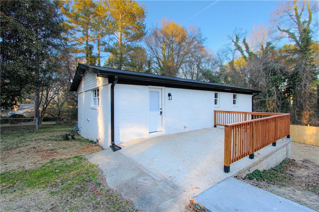 102 Welch Street Stockbridge, GA 30281 - Photo 24 of 28 a view of backyard with tree and wooden fence