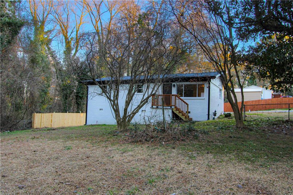 102 Welch Street Stockbridge, GA 30281 - Photo 28 of 28 a view of a house with a yard