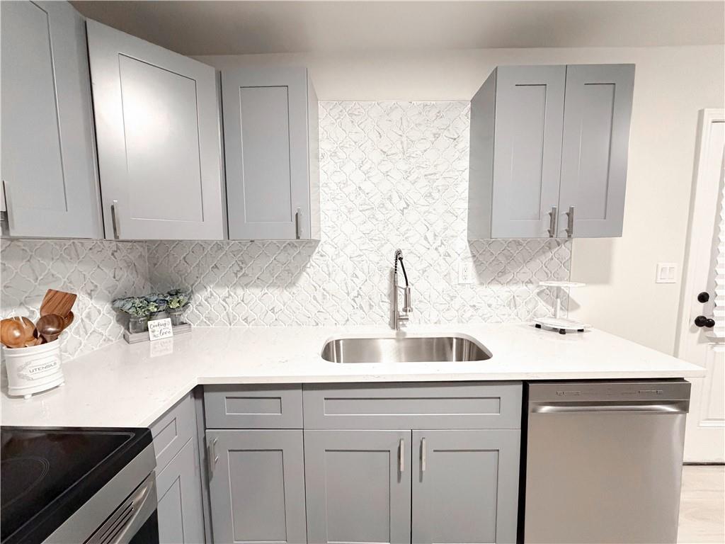 102 Welch Street Stockbridge, GA 30281 - Photo 10 of 28 a kitchen with a sink and cabinets