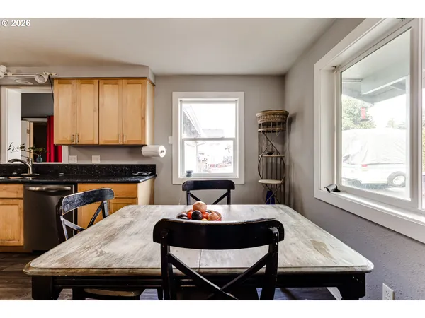 a kitchen with a stove a sink and a refrigerator