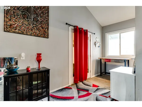 a couple of table and chairs in front of door