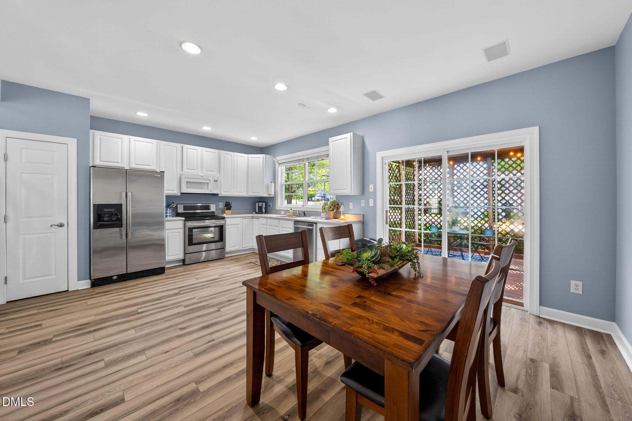 5500 Vista View Court Raleigh, NC 27612 - Photo 16 of 38 a view of a dining room with furniture window and wooden floor