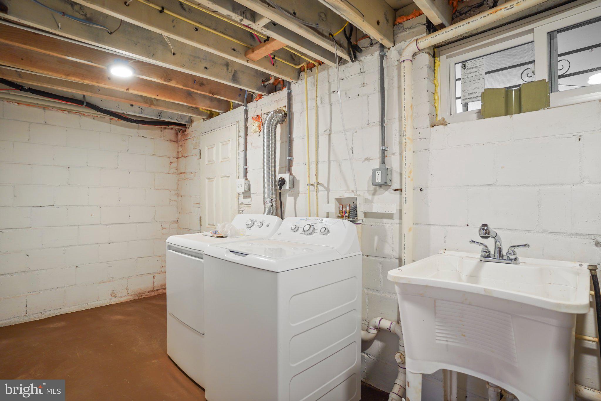 824 20th Street Northeast Washington, DC 20002 - Photo 15 of 17 Functional laundry space with utility sink.