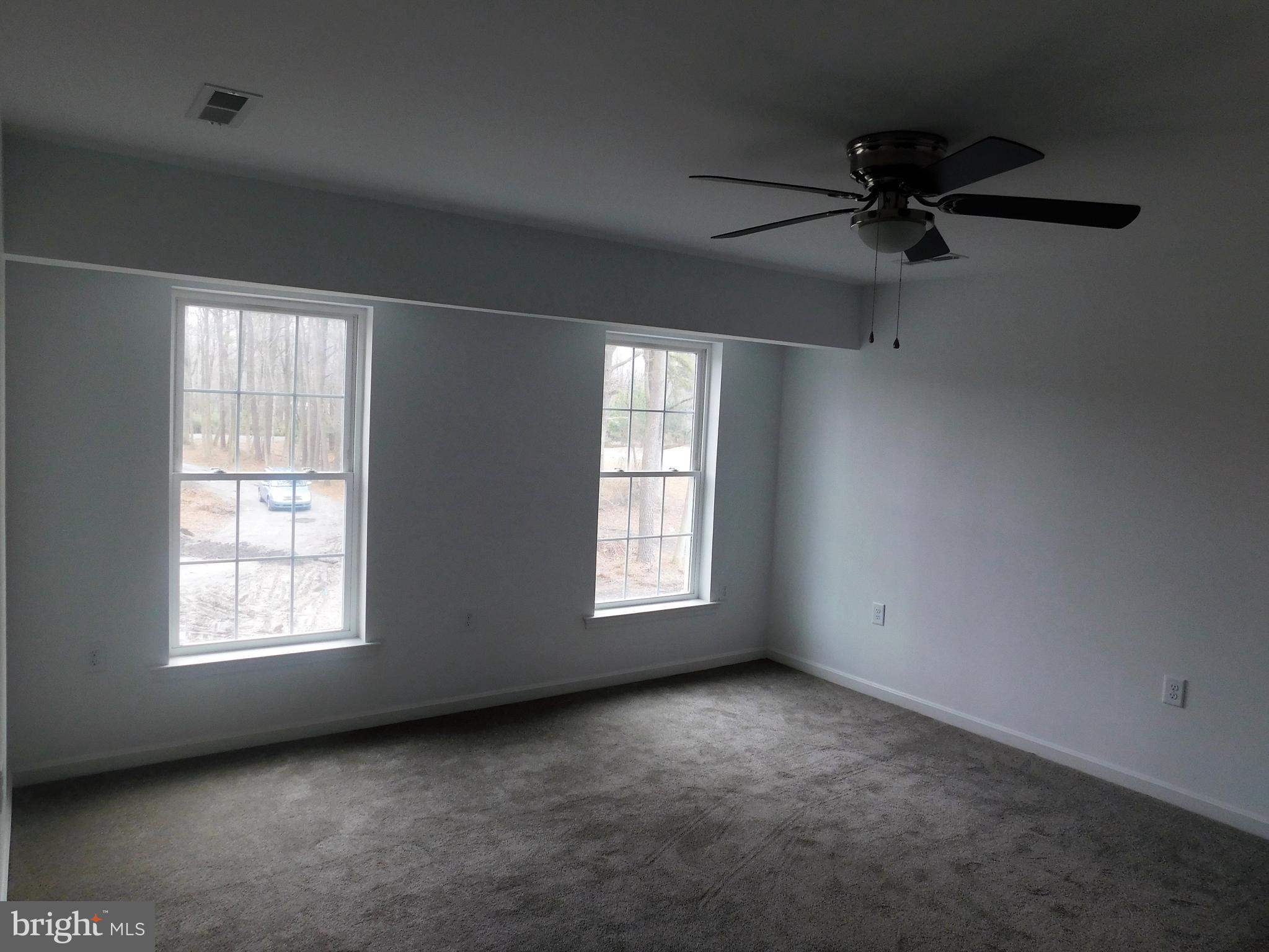 2 Whaleys Road Delmar, DE 19940 - Photo 14 of 28 an empty room with windows and fan