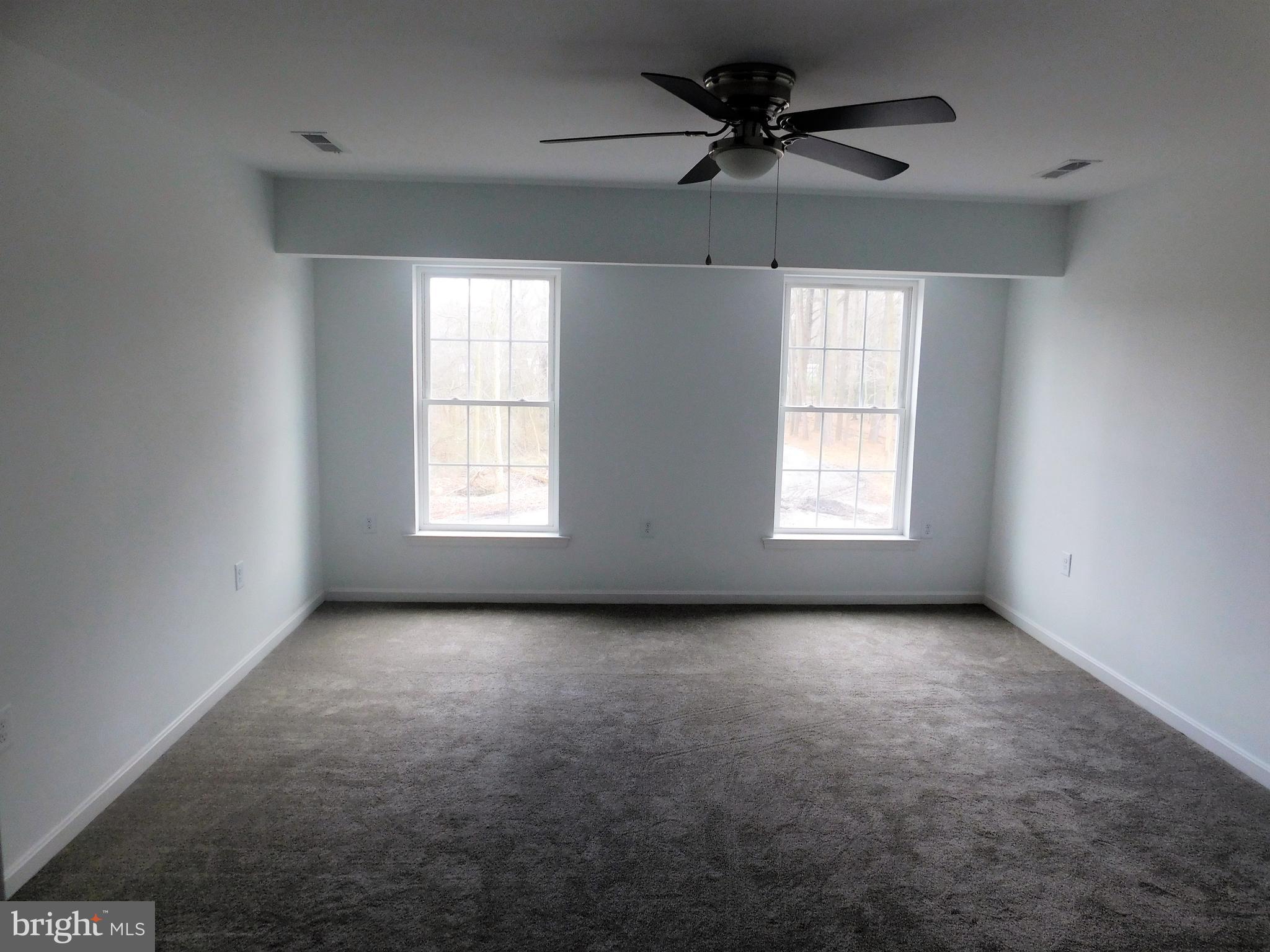 2 Whaleys Road Delmar, DE 19940 - Photo 15 of 28 a view of empty room with windows and ceiling fan