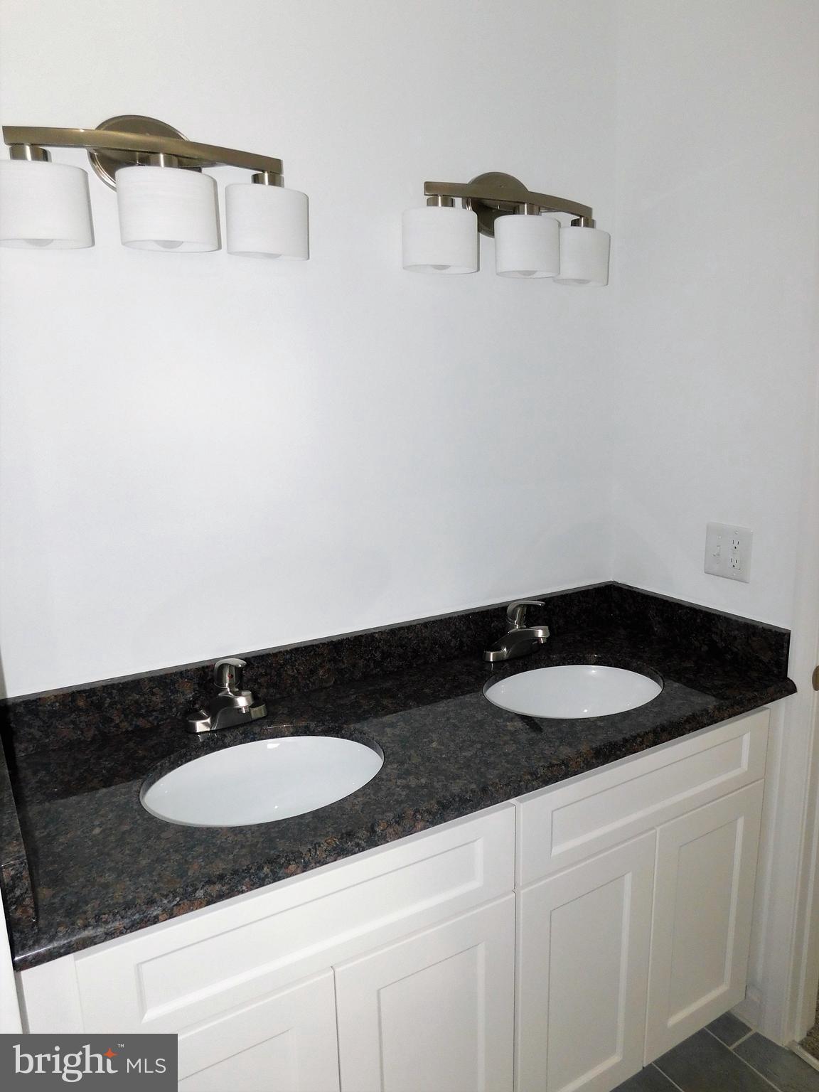 2 Whaleys Road Delmar, DE 19940 - Photo 18 of 28 a bathroom with a granite countertop sink and a mirror