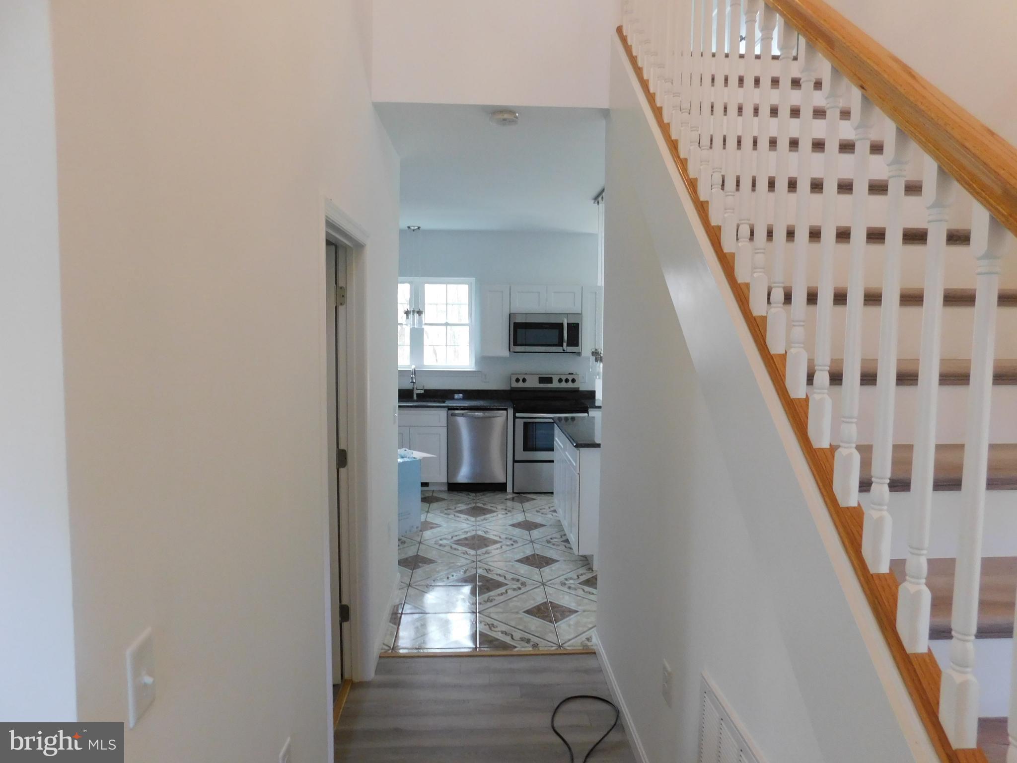 2 Whaleys Road Delmar, DE 19940 - Photo 5 of 28 a view of a hallway with wooden floor and staircase