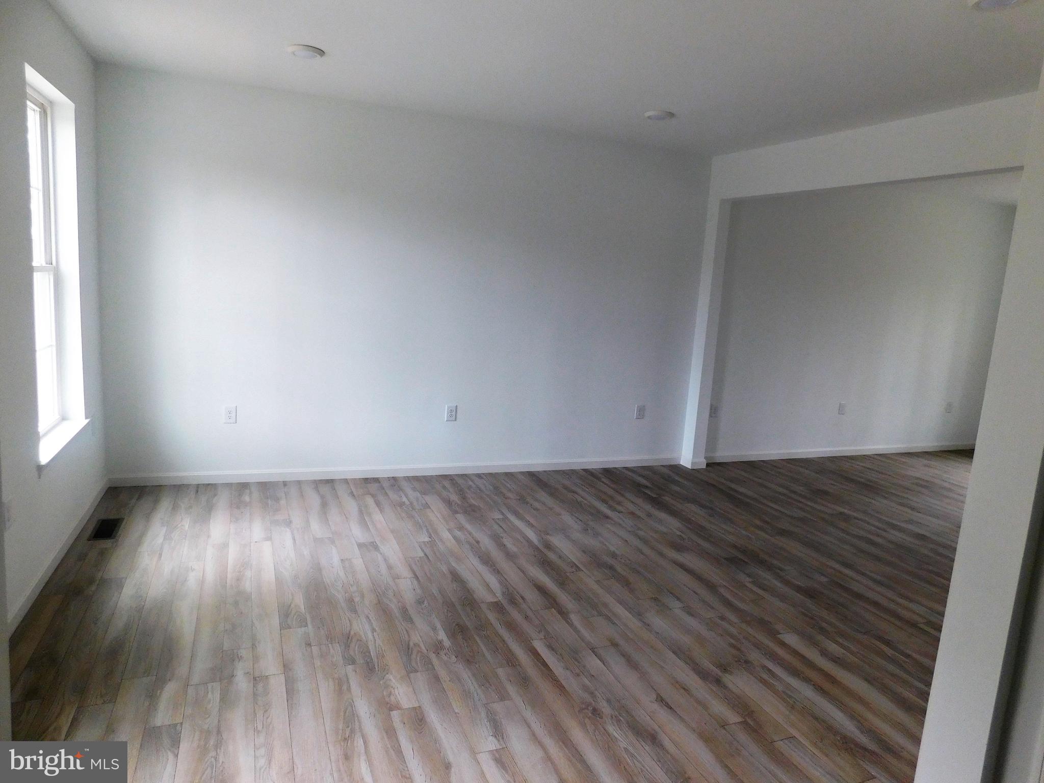 2 Whaleys Road Delmar, DE 19940 - Photo 6 of 28 an empty room with wooden floor and windows