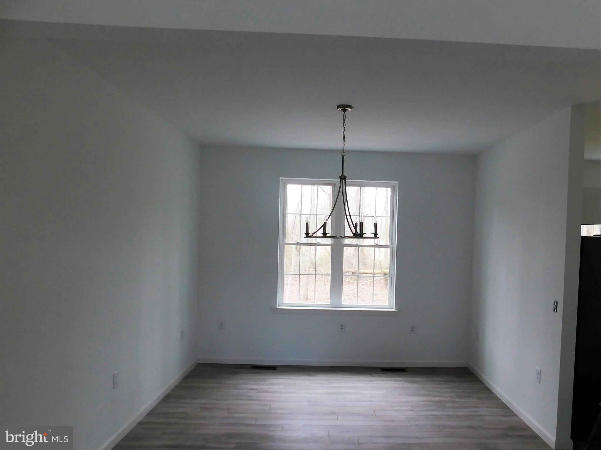 2 Whaleys Road Delmar, DE 19940 - Photo 8 of 28 a view of an empty room with wooden floor and fan