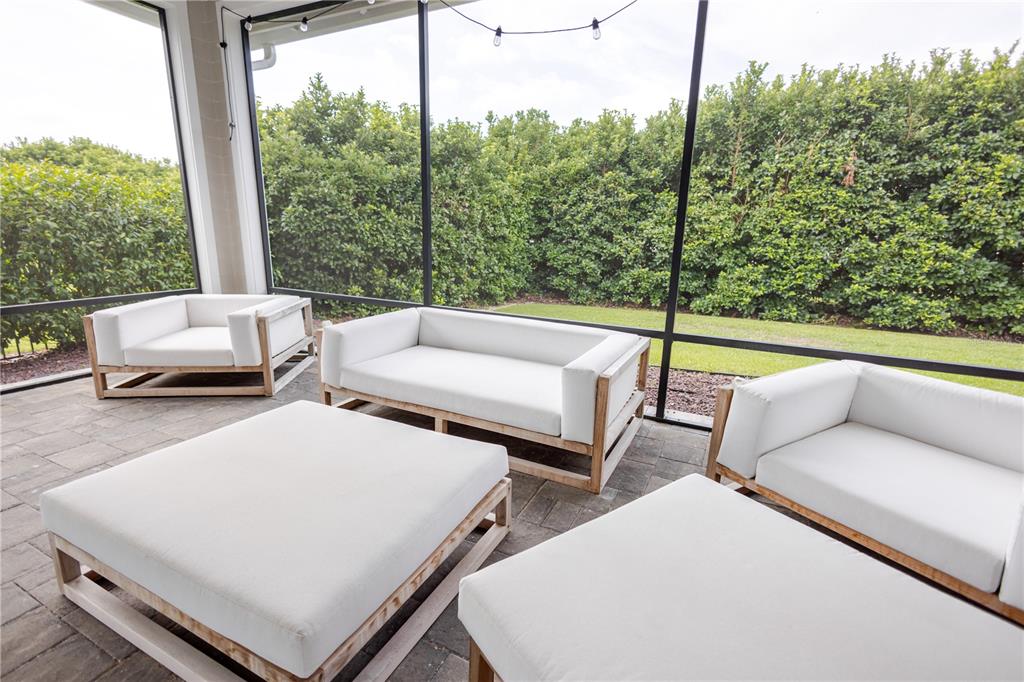 11967 Southwest 32nd Lane Gainesville, FL 32608 - Photo 14 of 22 a view of a patio with a couple of chairs and a couch