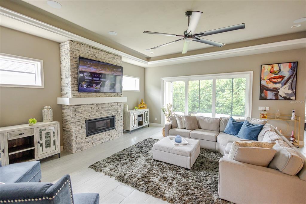 11967 Southwest 32nd Lane Gainesville, FL 32608 - Photo 17 of 22 a living room with furniture and a fireplace