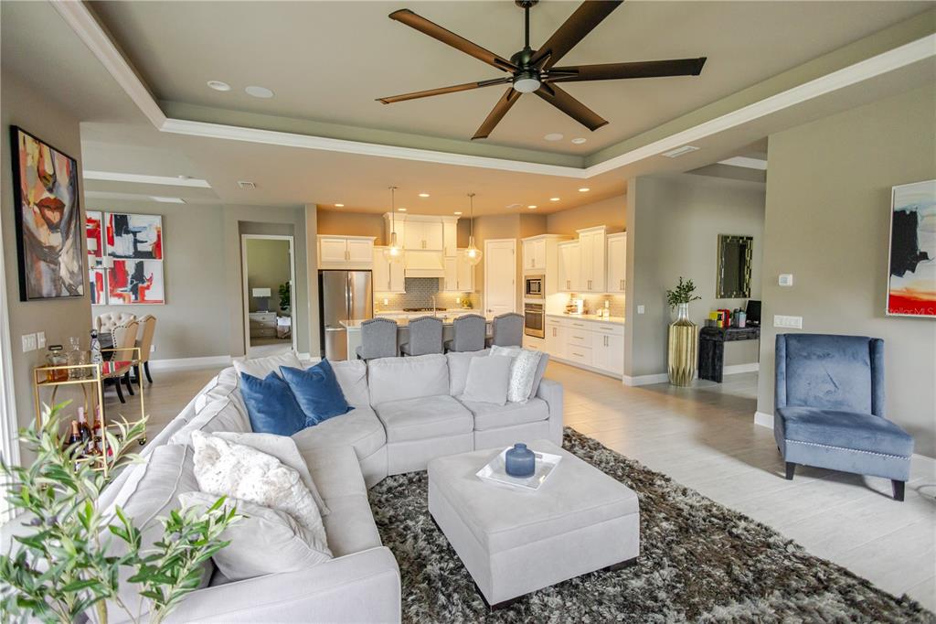 11967 Southwest 32nd Lane Gainesville, FL 32608 - Photo 18 of 22 a living room with furniture and a view of kitchen