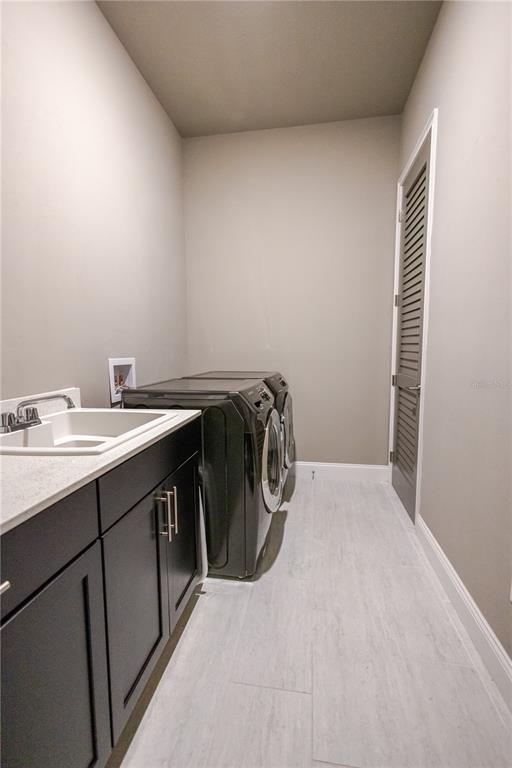 11967 Southwest 32nd Lane Gainesville, FL 32608 - Photo 22 of 22 a utility room with dryer and washer