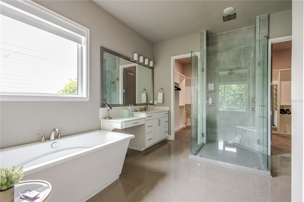 11967 Southwest 32nd Lane Gainesville, FL 32608 - Photo 4 of 22 a large spacious bathroom with a bathtub and a sink