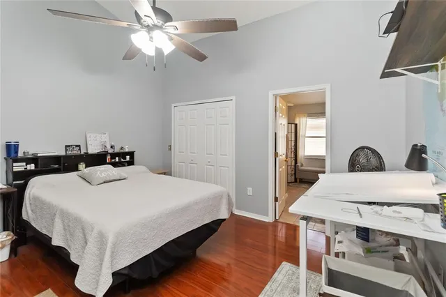 a bed room with a bed and a chandelier