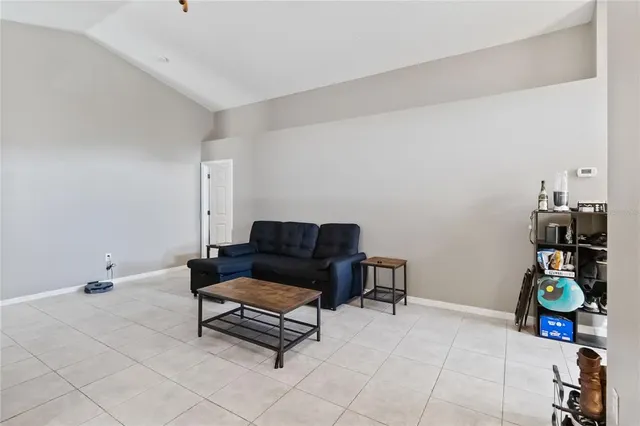 a kitchen with a dining table chairs and a dining table