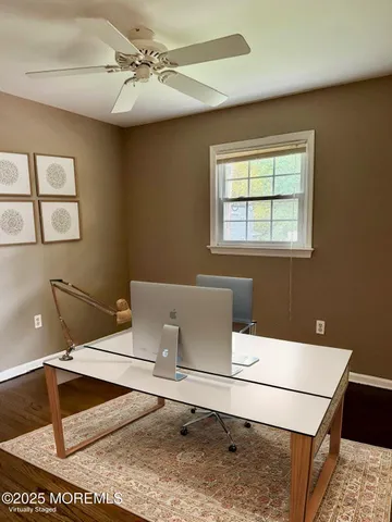 a workspace with furniture and window