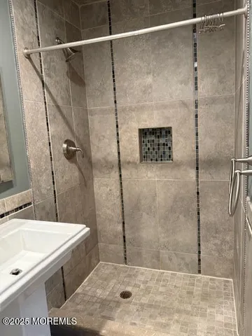 a bathroom with a sink and a shower