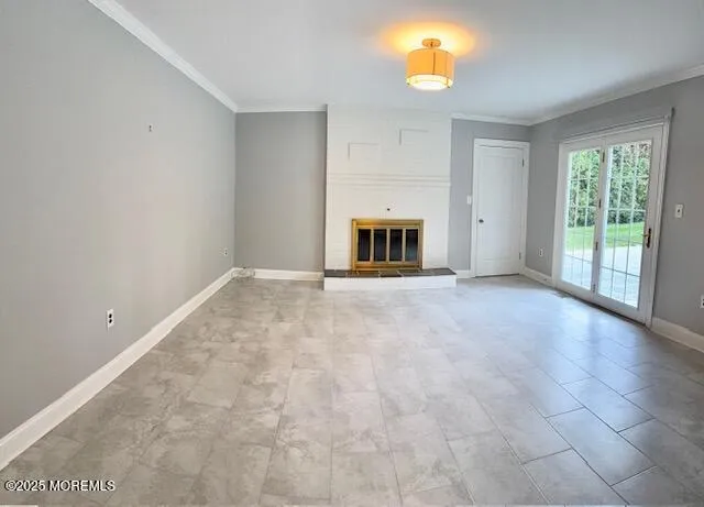 a view of empty room with a fireplace