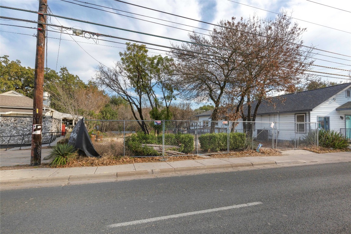 1809 South 1st Street Austin, TX 78704 - Photo 8 of 14 a city street with a building and trees in the background