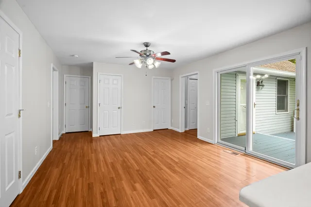 a view of an empty room with glass door