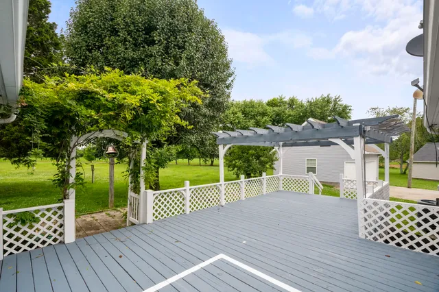 a view of a house with a wooden deck
