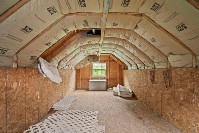 a view of a hallway with a black white checkered floor