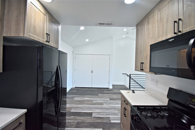2480 West 450 South, Unit 2 Springville, UT 84663 - Photo 8 of 19 Kitchen with black appliances, lofted ceiling, light wood finished floors, recessed lighting, and light wood finish cabinets