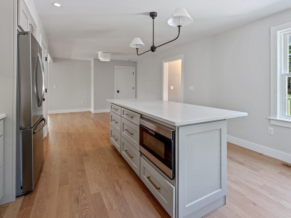 126 Old Southbridge Road Dudley, MA 01571 - Photo 18 of 40 a kitchen with a stove and a refrigerator