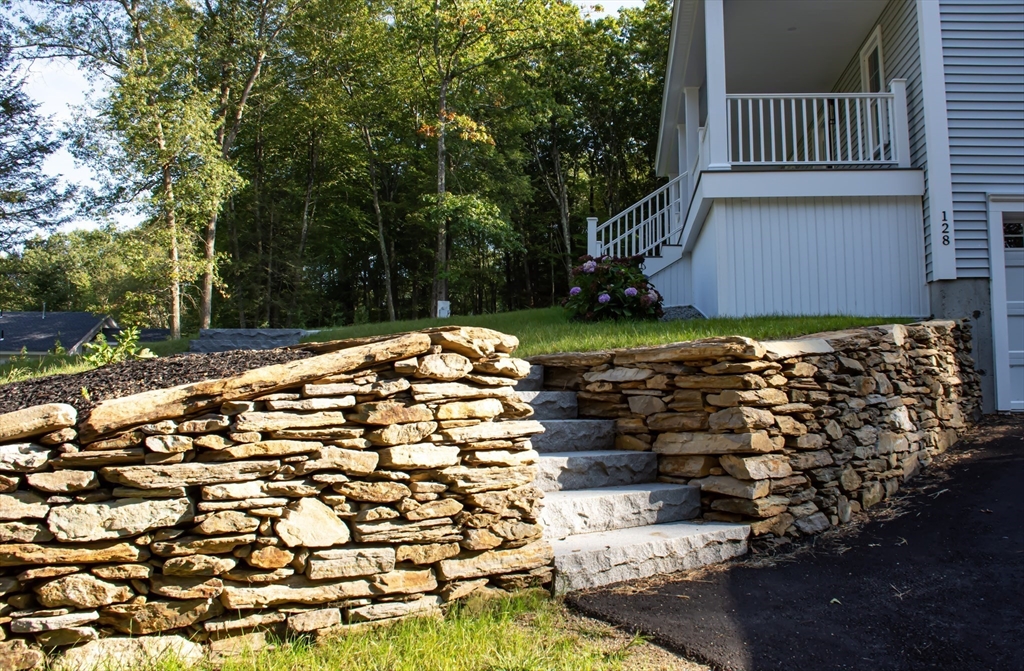 126 Old Southbridge Road Dudley, MA 01571 - Photo 2 of 40 a backyard of a house with a large tree