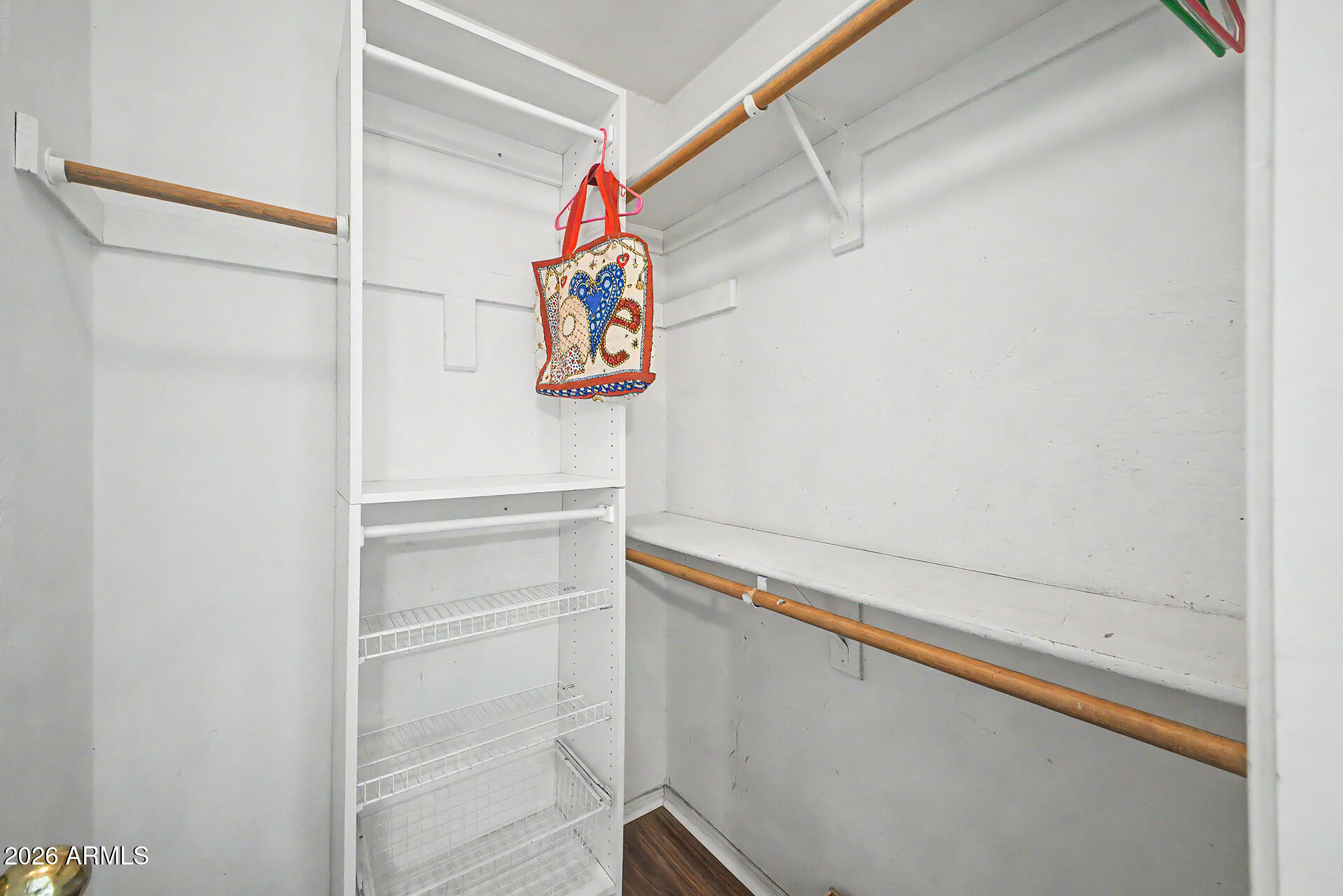 1924 East El Freda Road Tempe, AZ 85284 - Photo 49 of 56 a view of walk in closet with empty racks