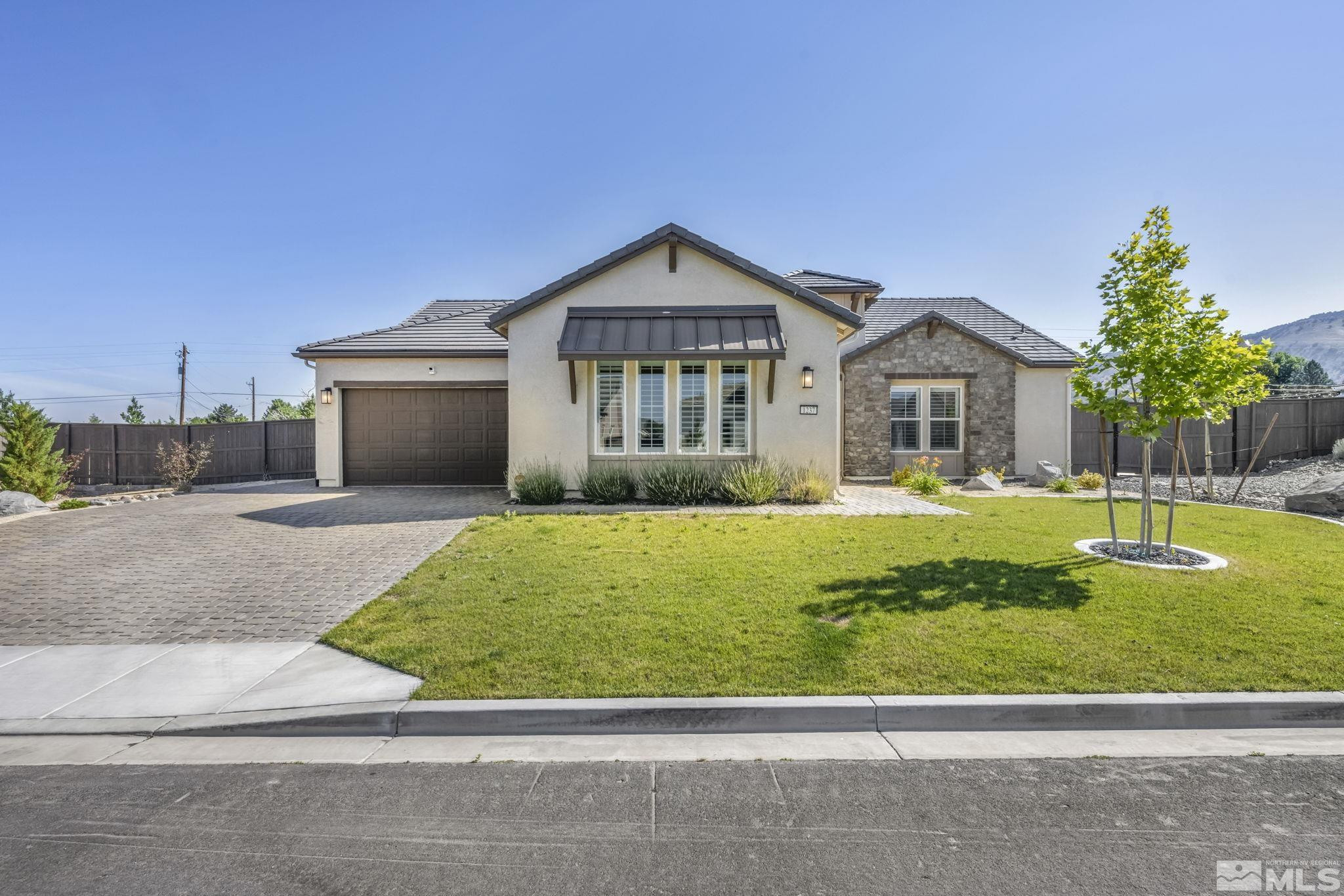 1237 Crawford Crk Drive Reno, NV 89521 - Photo 1 of 39 a front view of a house with a yard