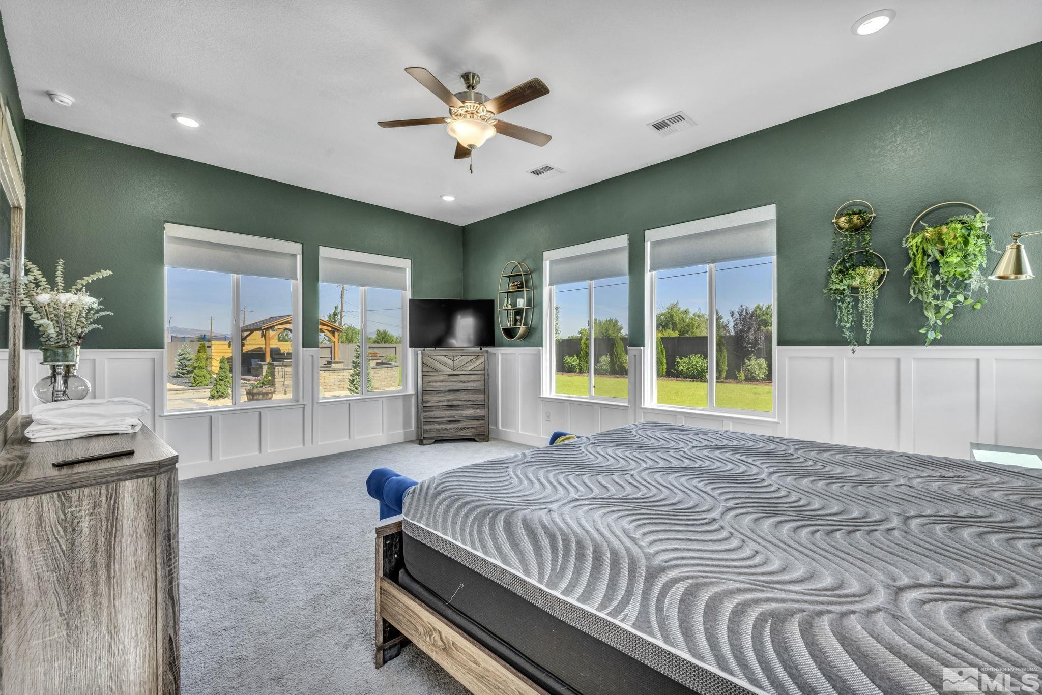 1237 Crawford Crk Drive Reno, NV 89521 - Photo 12 of 39 a spacious bedroom with a large bed and a chandelier
